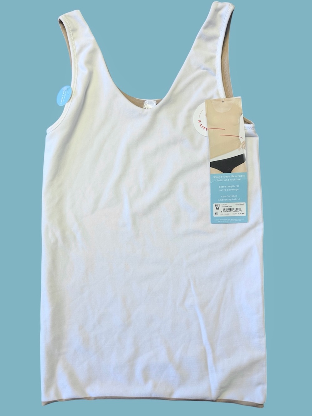 New with tags assets SPANX reversible
4 way tank top white to barely Size Medium